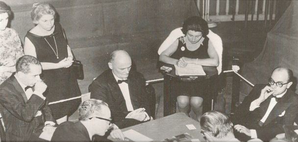 A hand  from Buenos Aires. Here Reese shows 3 fingers on the backs of the cards and has three hearts. The British Captain, Ralph Swimer looks on sitting in Reese’s left and is taking notes. Look how immaculately the players are dressed in 1965. You don’t see that these days. Source: The Great Bridge Scandal.