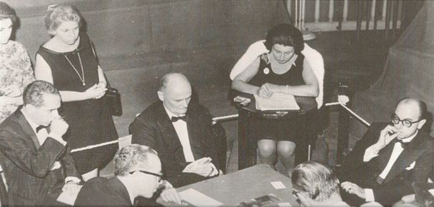 A hand  from Buenos Aires. Here Reese shows 3 fingers on the backs of the cards and has three hearts. The British Captain, Ralph Swimer looks on sitting in Reese’s left and is taking notes. Look how immaculately the players are dressed in 1965. You don’t see that these days. Source: The Great Bridge Scandal.